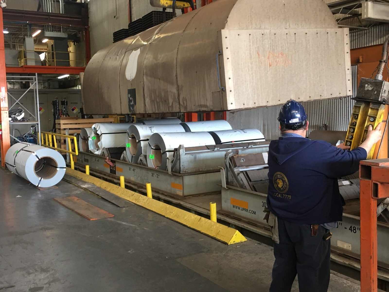 Steel coils staged at a processing facility